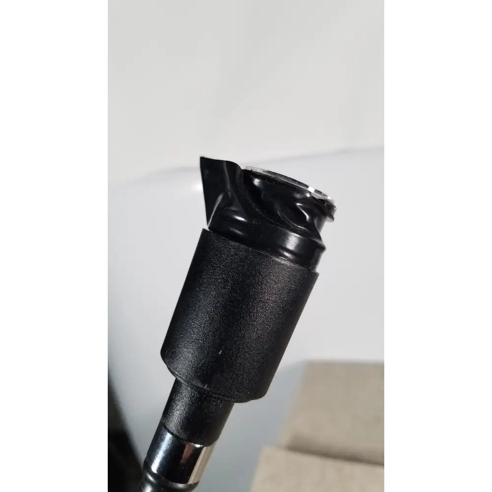 Black rubberized grip with metallic silver cap on adjustable pole of welch allyn 48200 fiberoptic light pipe