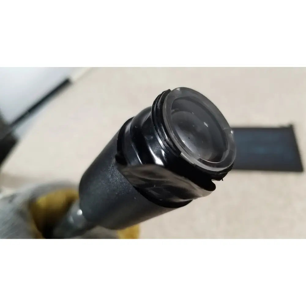 Black plastic welch allyn fiberoptic light pipe with threaded metal ring and clear glass for medical exams