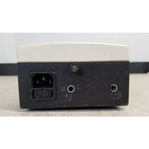 Welch Allyn 48740 exam light power supply unit black and beige rectangular with ac input port on left side back view