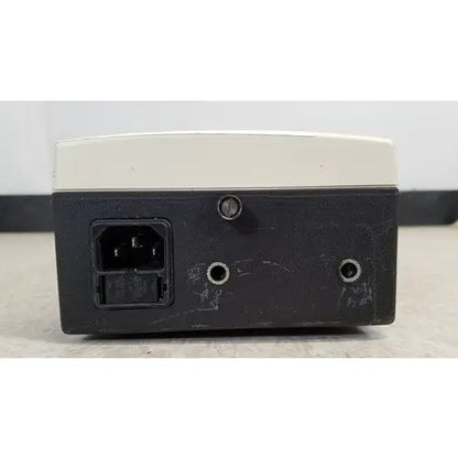 Welch Allyn 48740 exam light power supply unit black and beige rectangular with ac input port on left side back view