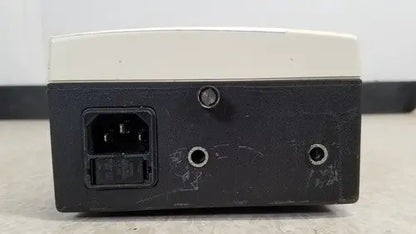 Welch Allyn 48740 exam light power supply unit black and beige rectangular with ac input port on left side back view