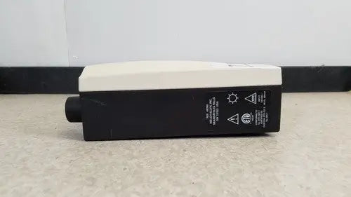 Black and white welch allyn 48740 exam light with cylindrical protrusion designed for medical examination lights use