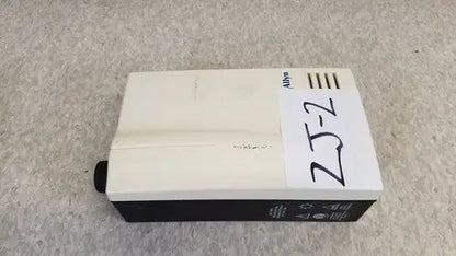 White and black rectangular welch allyn exam light with 25-2 label designed for medical examination use