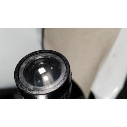 Black textured lens cap with clear glass insert on welch allyn 48740 exam light with exam light neck