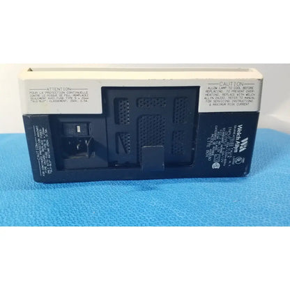 Back side of a welch allyn 48830 lite box black and white reuse medical device with vented panel labeled wectron