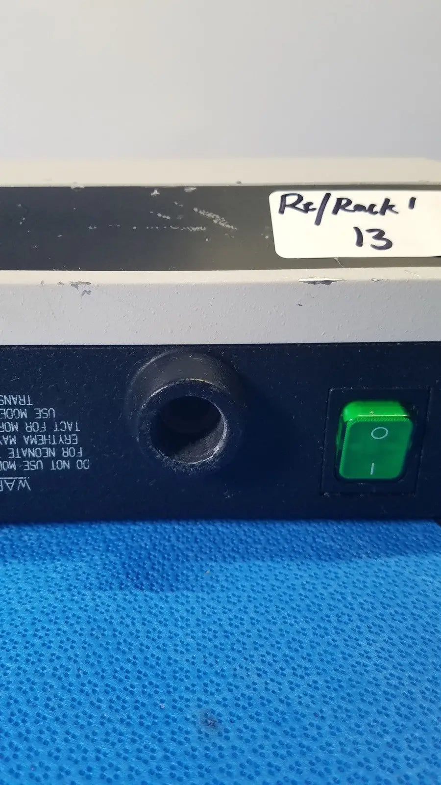 Welch allyn lite box black and gray electronic device with green power button and circular port labeled rsl rock 13 reuse medical