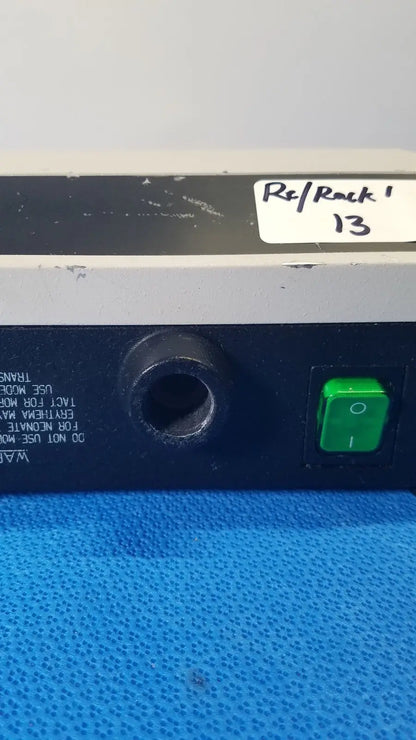 Welch allyn lite box black and gray electronic device with green power button and circular port labeled rsl rock 13 reuse medical