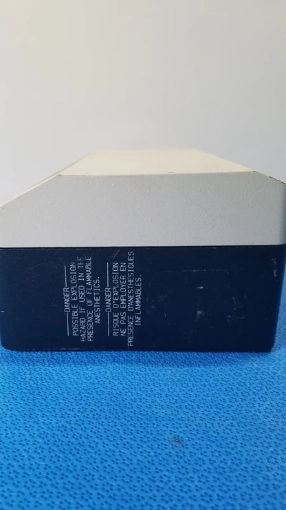 Black and white rectangular reuse medical lite box by welch allyn with warning labels in english and french on the back side
