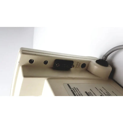 Beige plastic back side of welch allyn 52000 series vital signs monitor with black vga port and ventilation holes