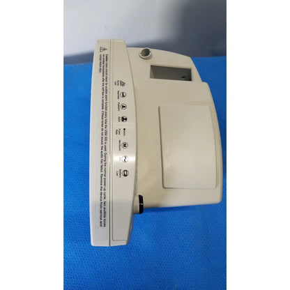 Beige plastic welch allyn 530t0 vital signs monitor with rectangular screen control buttons and warning labels on side
