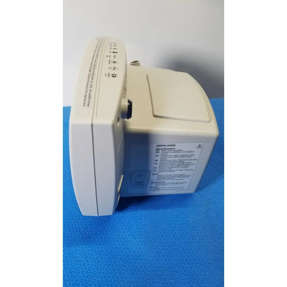 Beige welch allyn 530t0 vital signs monitor with rectangular design and printed error codes on the side panel