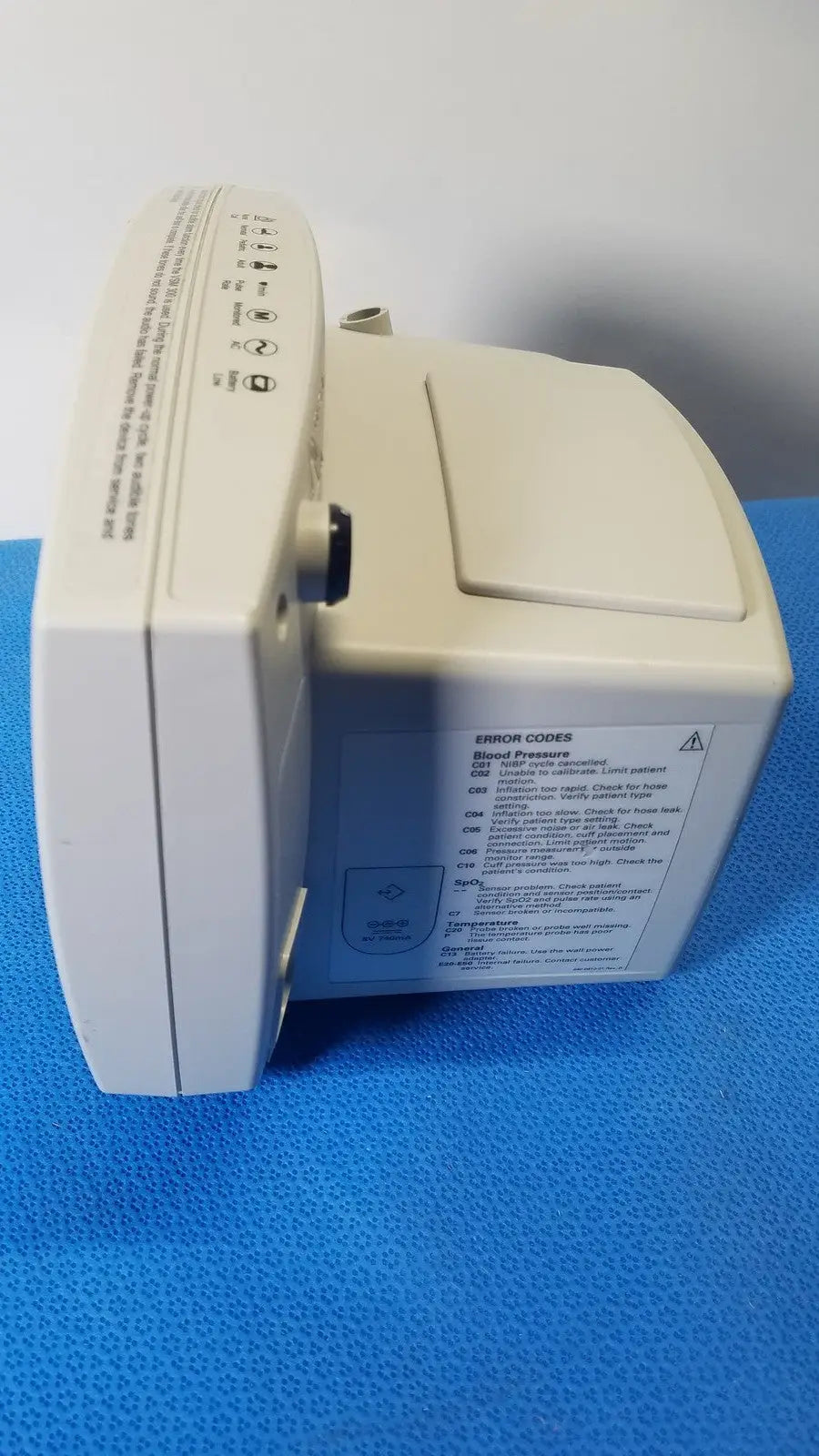 Beige welch allyn 530t0 vital signs monitor with rectangular design and printed error codes on the side panel