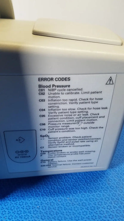 Beige welch allyn 530t0 vital signs monitor displaying error codes for blood pressure spo2 and temperature readings