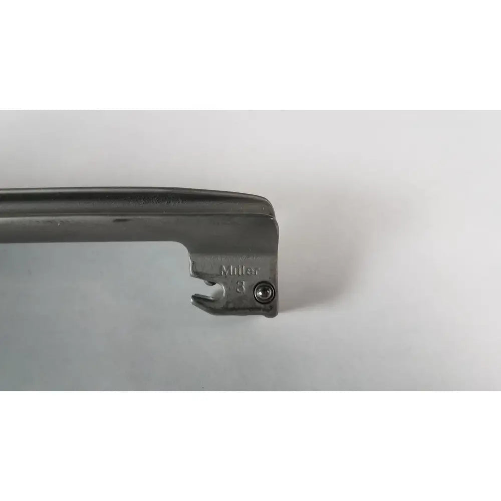 Black metal welch allyn laryngoscope blade miller size 3 with sharp angled edge and engraved branding