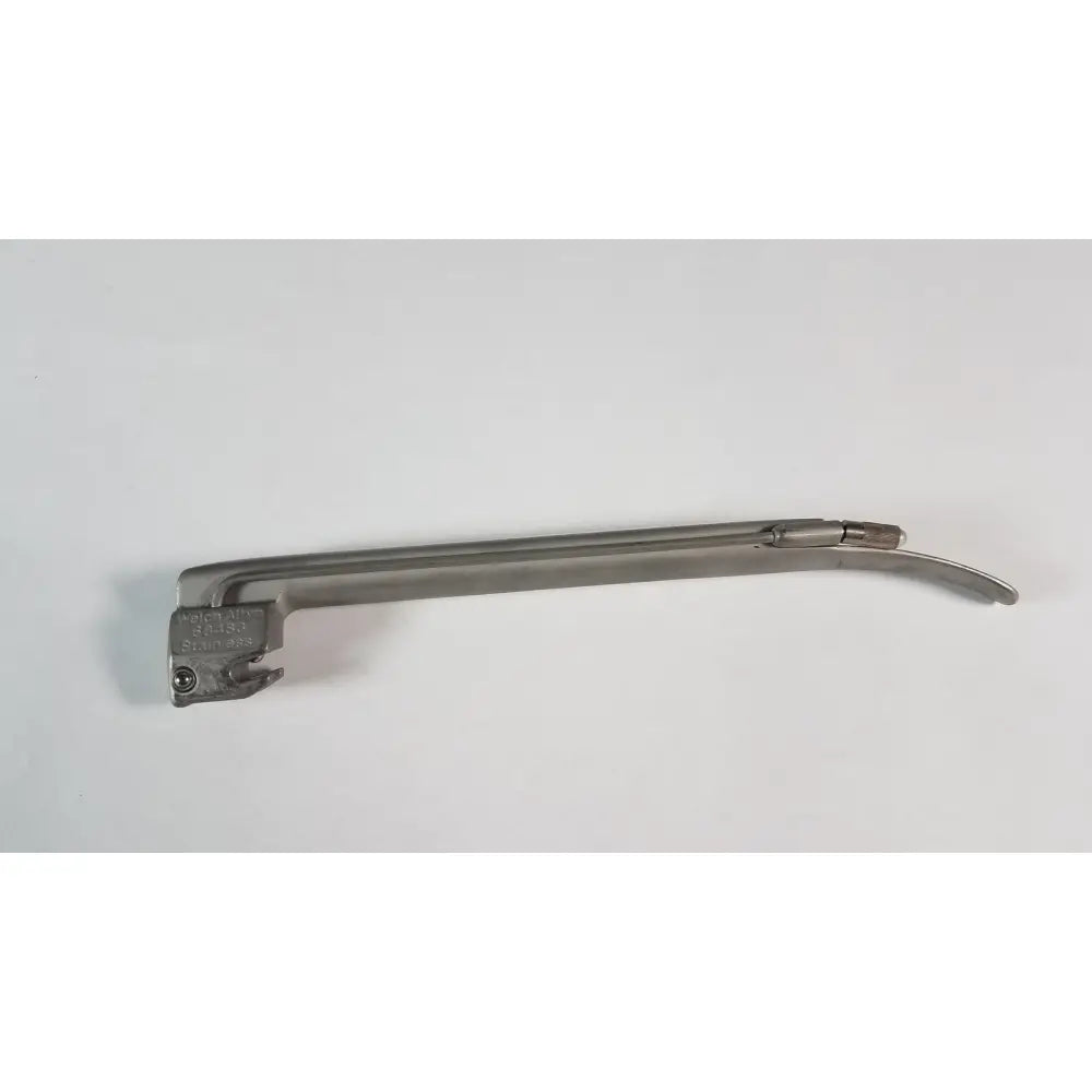 Silver stainless steel welch allyn laryngoscope handle with engraved markings and curved blade miller size 3