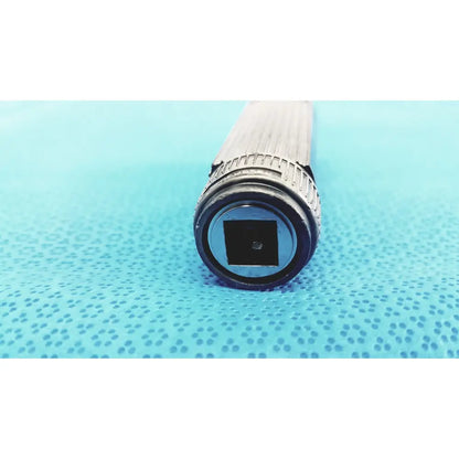 Silver metallic welch allyn rectal light handle with textured grip and black circular head for medical examination illumination