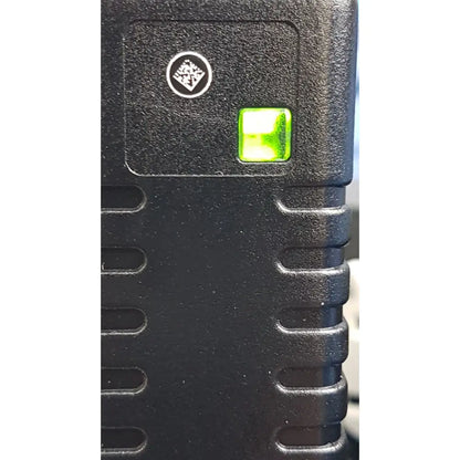 Welch Allyn black textured plastic power adapter plug with glowing green indicator light for medical device use