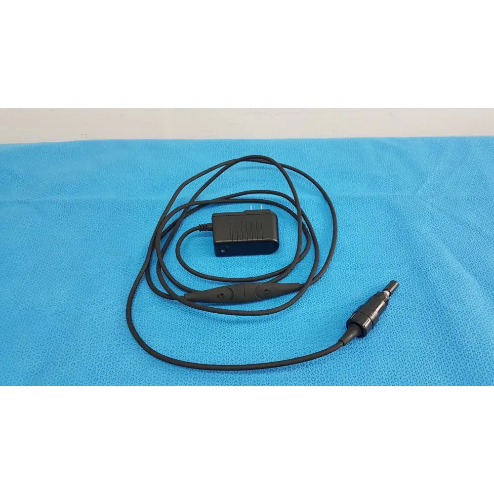 Black coiled cable with rectangular power adapter plug for welch allyn 73305 6v medical device power adapter