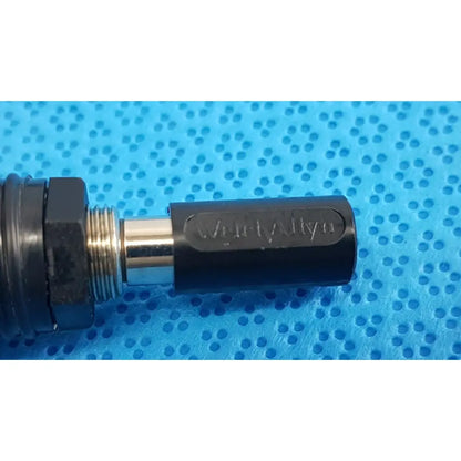 Black and silver verity allen mechanical component with threaded metal shaft of welch allyn 6v power adapter plug