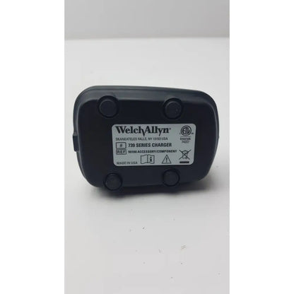 Black plastic welch allyn 739 series charger with white label showing model and certification for reuse medical use