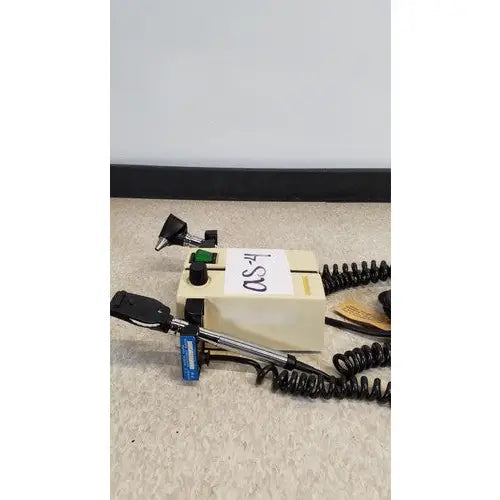 Beige welch allyn 74710 transformer otoscope ophthalmoscope with black coiled cord and metallic handles
