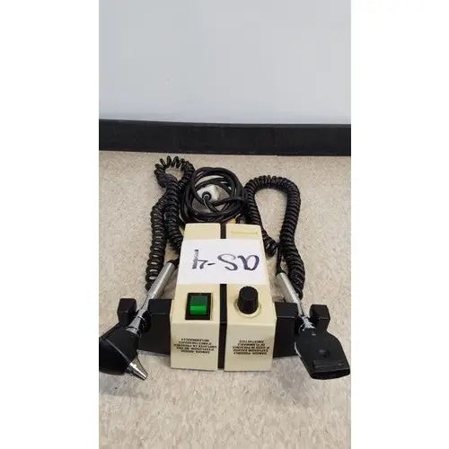 Beige welch allyn transformer otoscope ophthalmoscope with black coiled cords and two metal probes attached