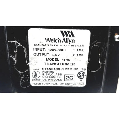 Welch allyn 7471c wall transformer ophthalmoscope otoscope with black casing and white technical specification label