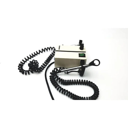 Beige welch allyn wall transformer ophthalmoscope with metallic handle and black coiled cord for medical use