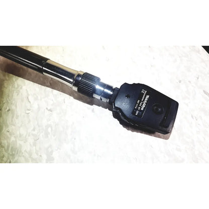 Black handheld welch allyn series transformer otoscope with metallic joint textured grip for diagnostic wall transformer use