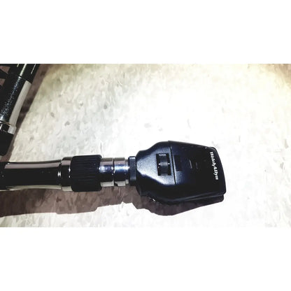 Welch Allyn 767 series transformer with heads featuring a black otoscope with textured grip and metallic joints