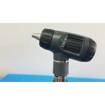Welch allyn 767 series transformer with otoscope featuring black and silver textured grip, green power light, and adjustable focus dial