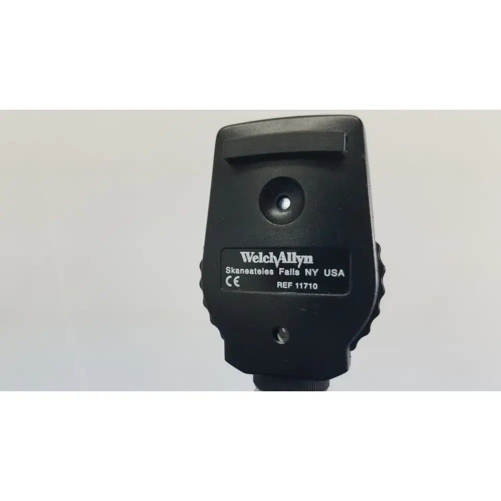 Black Welch Allyn 11710 ophthalmoscope with matte finish and textured grip in Welch Allyn 767 Series Transformer for reuse medical use
