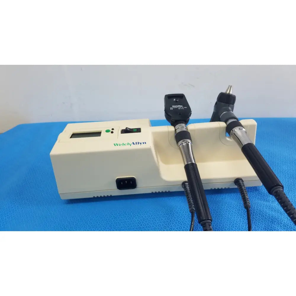 Beige welch allyn 767 series transformer medical device with two black-handled attachments and digital display for reuse medical use
