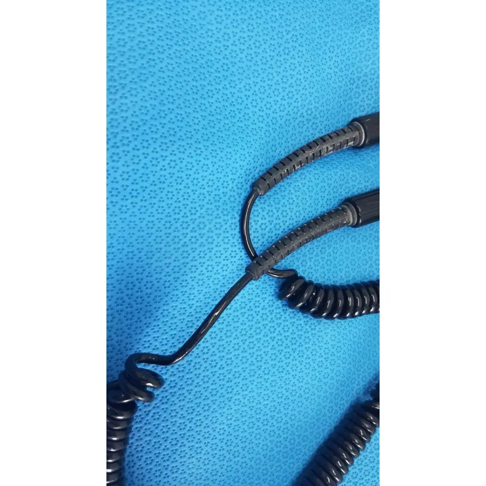 Black coiled cable with textured segmented protective sheathing for welch allyn 767 series transformer reuse medical device