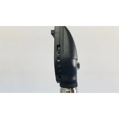 Black plastic otoscope with metallic silver stem in welch allyn 767 series transformer for reuse medical exams