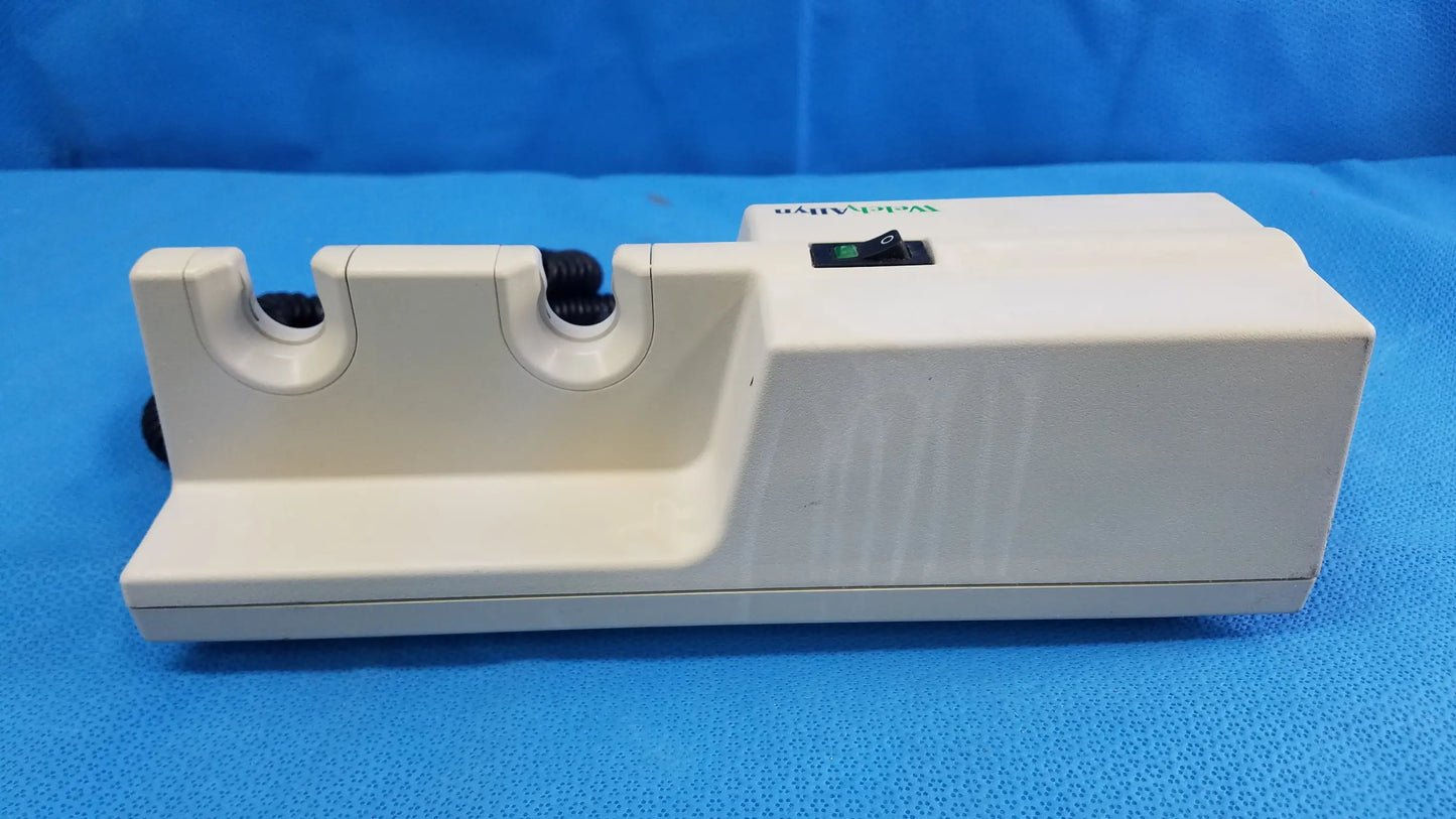 White plastic electric knife sharpener with two slots and black power switch compatible with welch allyn wall-mounted diagnostic power units without instrument heads