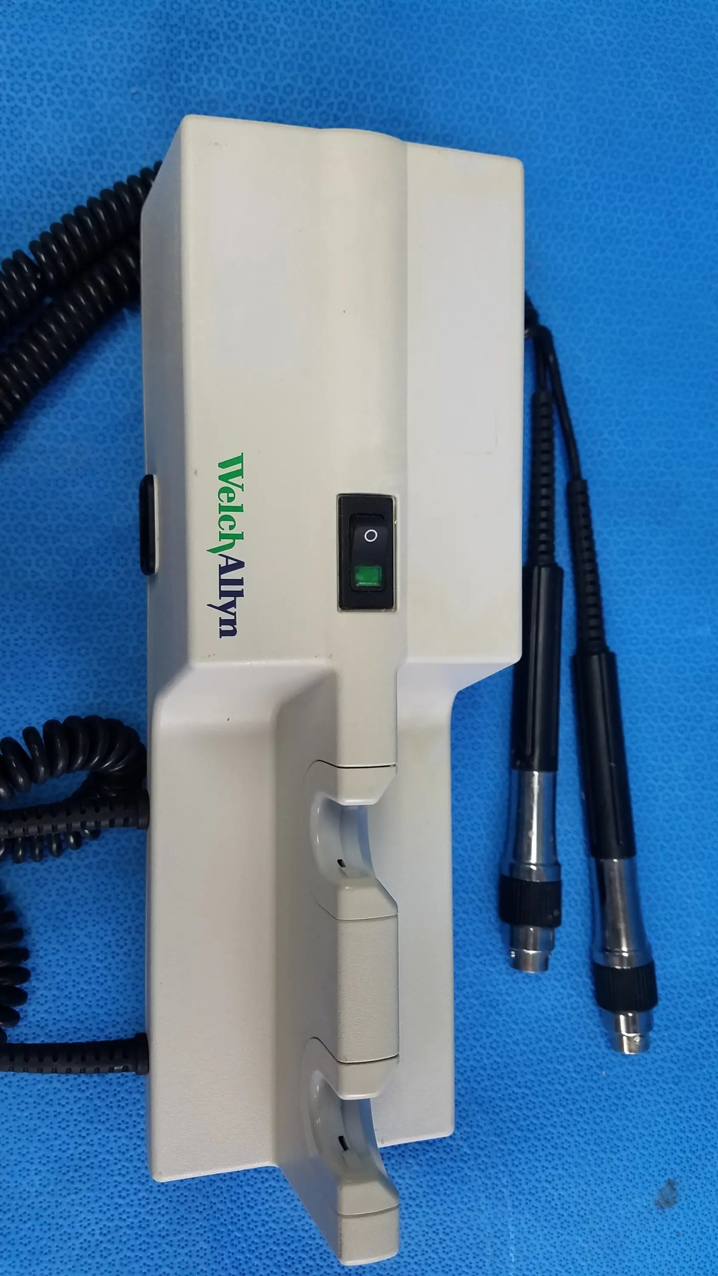 White plastic welch allyn 767 series wall-mounted diagnostic power transformer with black coiled cables no instrument heads