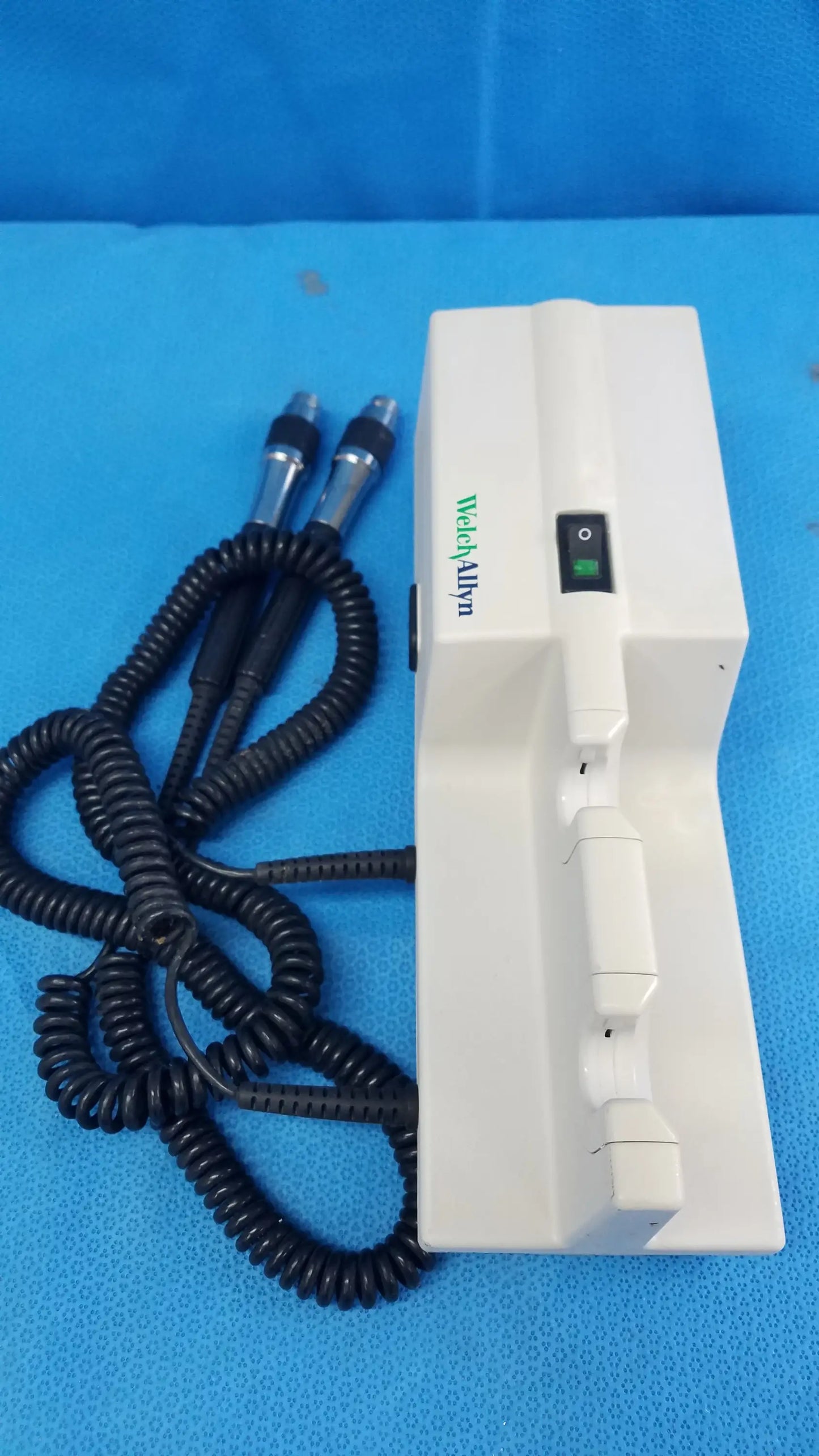White rectangular welch allyn 767 series transformer with black cables for wall-mounted diagnostic power without instrument heads