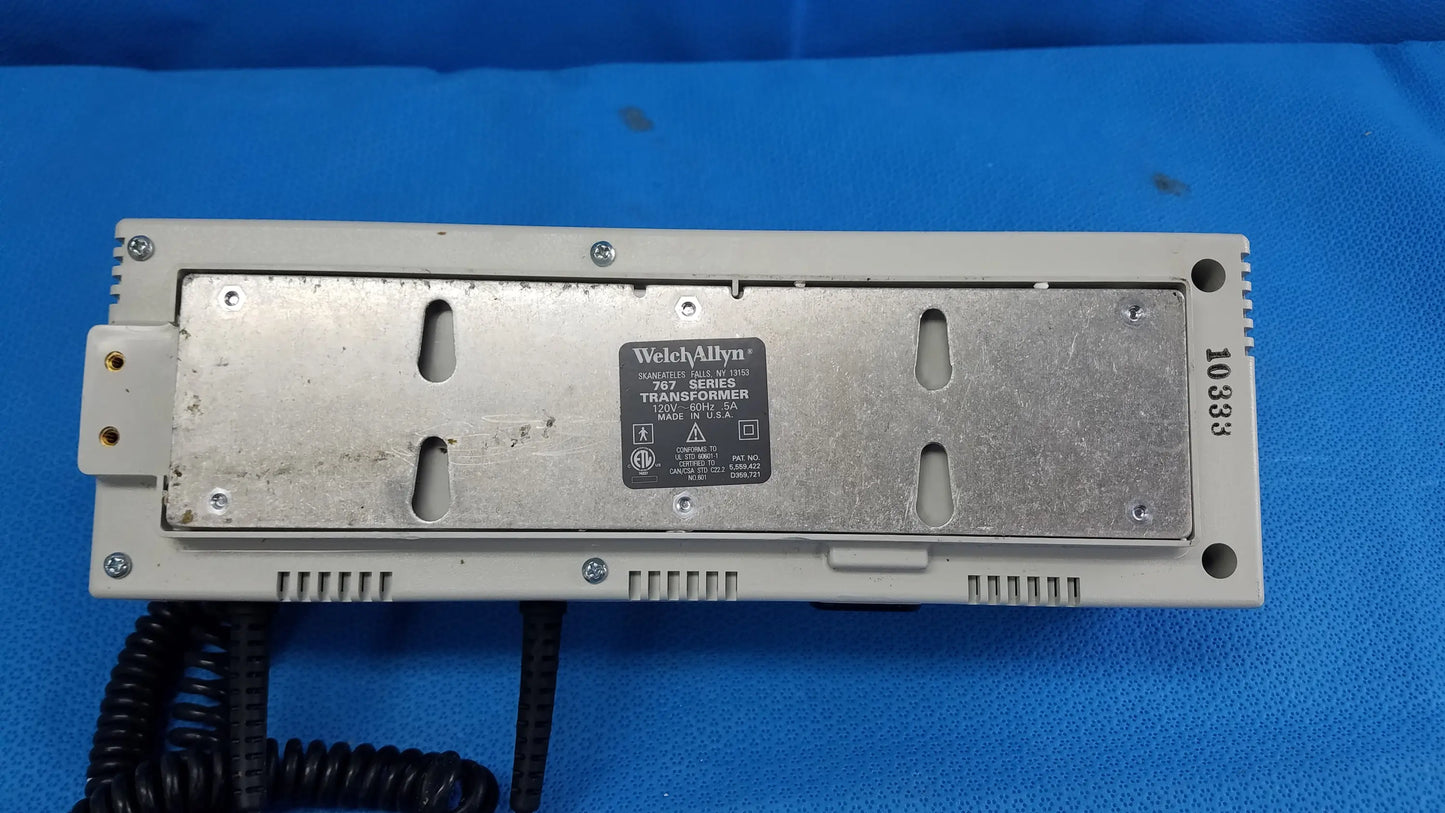 Gray plastic welch allyn 761 series transformer with metallic backplate and black coiled cable for wall-mounted diagnostic power without instrument heads
