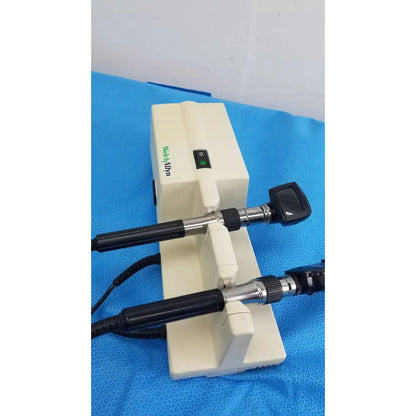 White medical otoscope with black handles and silver joints branded medialpin in welch allyn 767 series wall transformer
