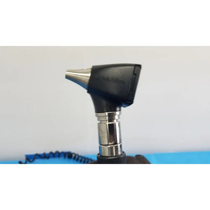 Black and silver otoscope with sleek ergonomic design in welch allyn 767 series wall transformer medical set