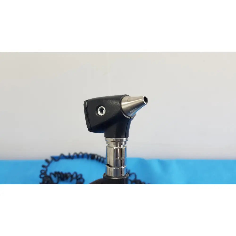 Black and silver welch allyn 767 series wall transformer otoscope with textured grip metallic tip and coiled cable