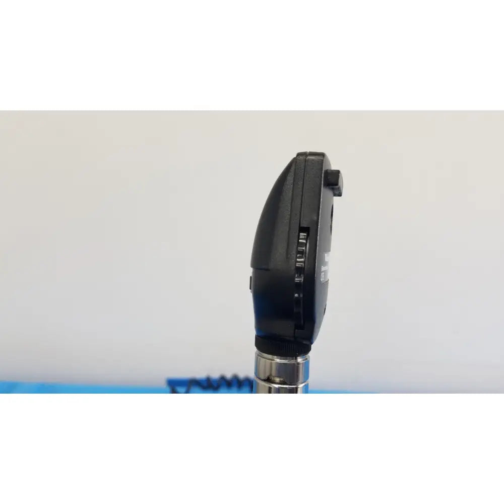Black plastic otoscope with silver metallic stem as part of welch allyn 767 series wall transformer set
