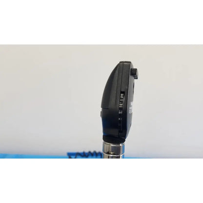 Black plastic otoscope with silver metallic stem as part of welch allyn 767 series wall transformer set