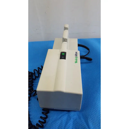 Welch allyn 767 series wall transformer with panoptic ophthalmoscope featuring white body green power indicator and black cord