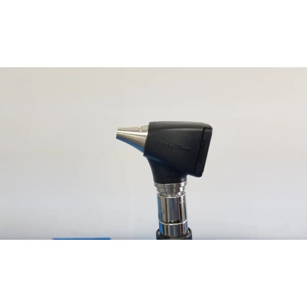 Black and silver otoscope with sleek ergonomic design in welch allyn 767 series wall transformer set