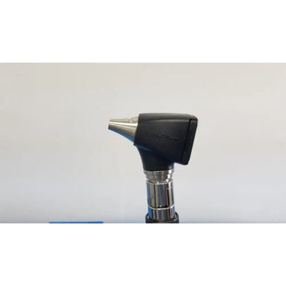Black and silver otoscope with sleek ergonomic design in welch allyn 767 series wall transformer set