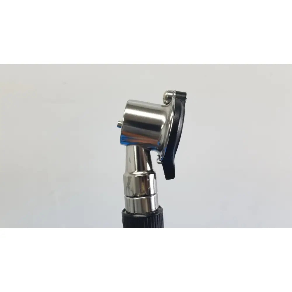 Silver metallic otoscope with black rubberized grip and adjustable headpiece in welch allyn wall transformer with coaxial ophthalmoscope