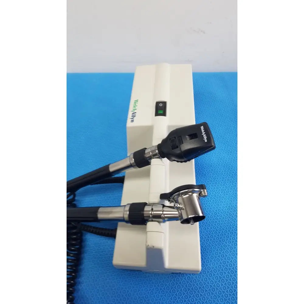 Welch Allyn 767 wall transformer with white and black coaxial ophthalmoscope featuring a sleek ergonomic design