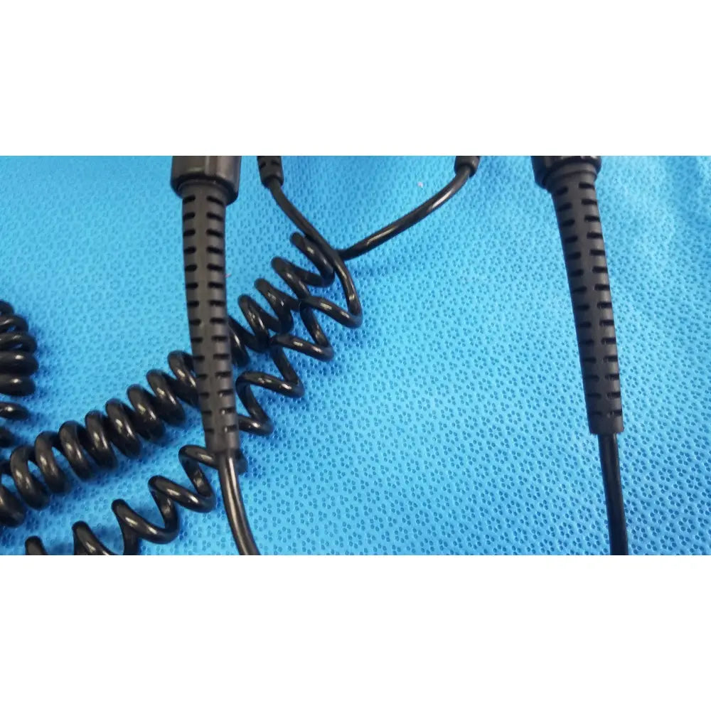 Black coiled cable with textured ribbed connectors for welch allyn wall transformer reuse medical applications